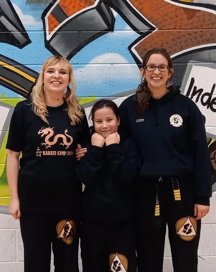 WE ARE DEDICATED TO YOUR OVERALL CHARACTER GROWTH & DEVELOPMENT THROUGH MARTIAL ARTS